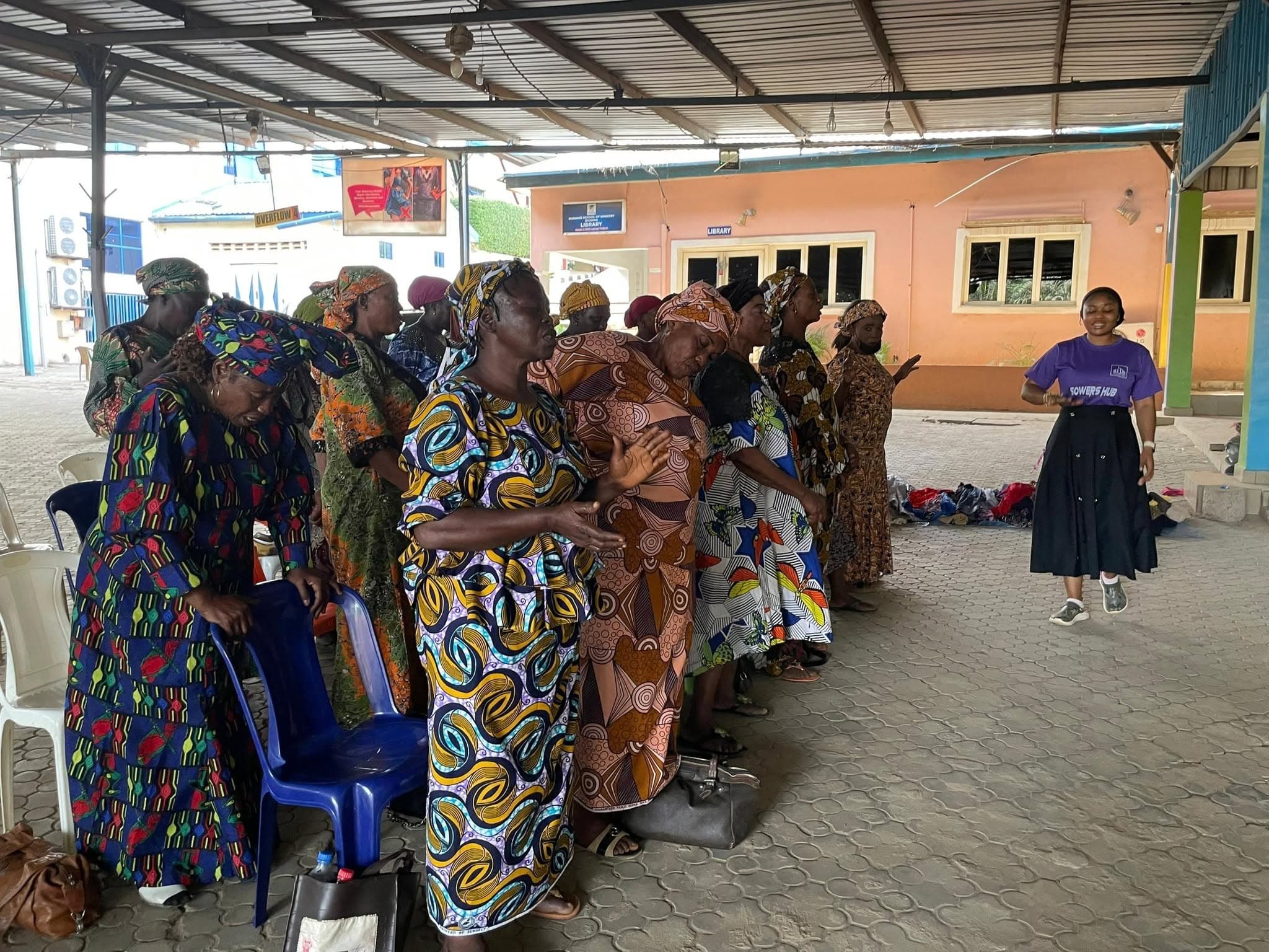 Widows gathered in prayer at a SowersHub outreach in Wuse, Abuja