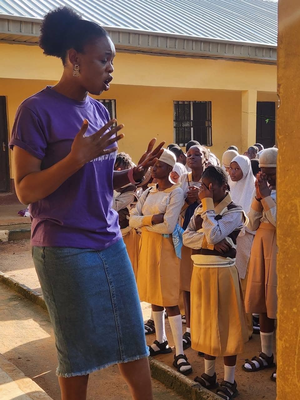 A SowersHub volunteer speaking with schoolgirls during a purity education session