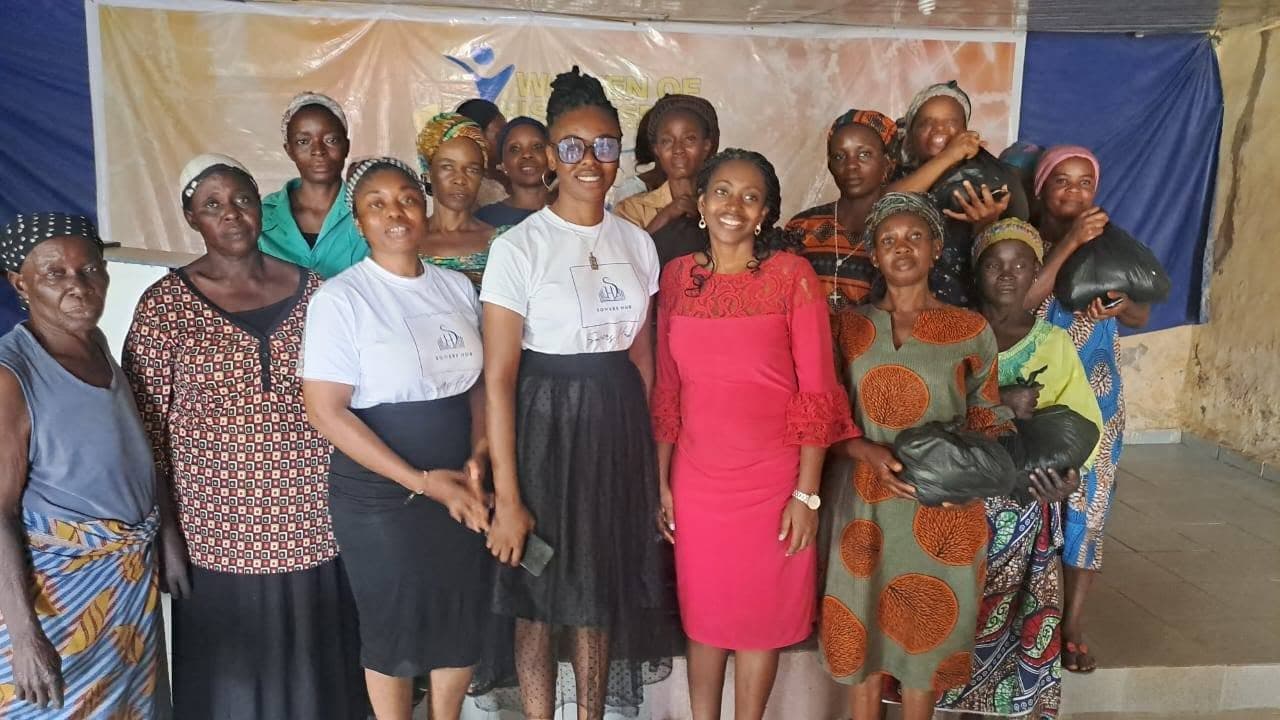 The SowersHub team with widows receiving provisions at an outreach