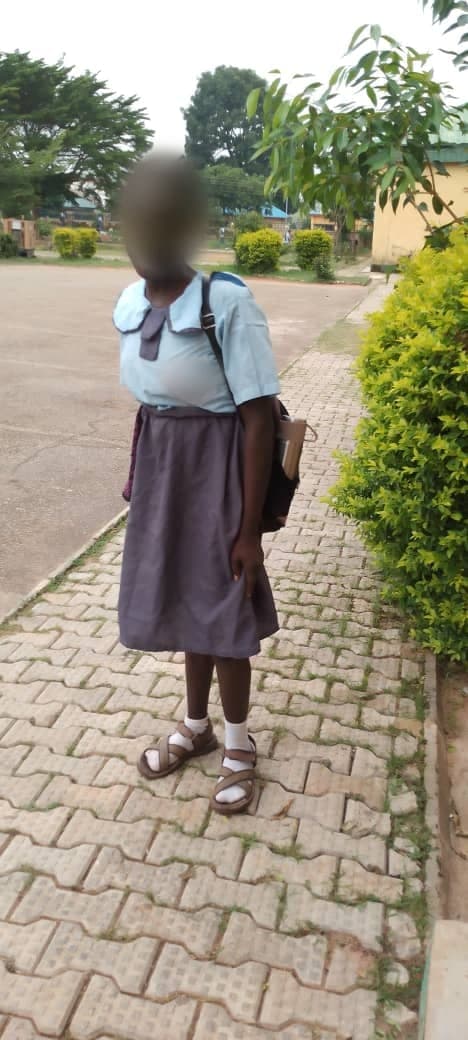 Jessica in her secondary school uniform, with her school bag